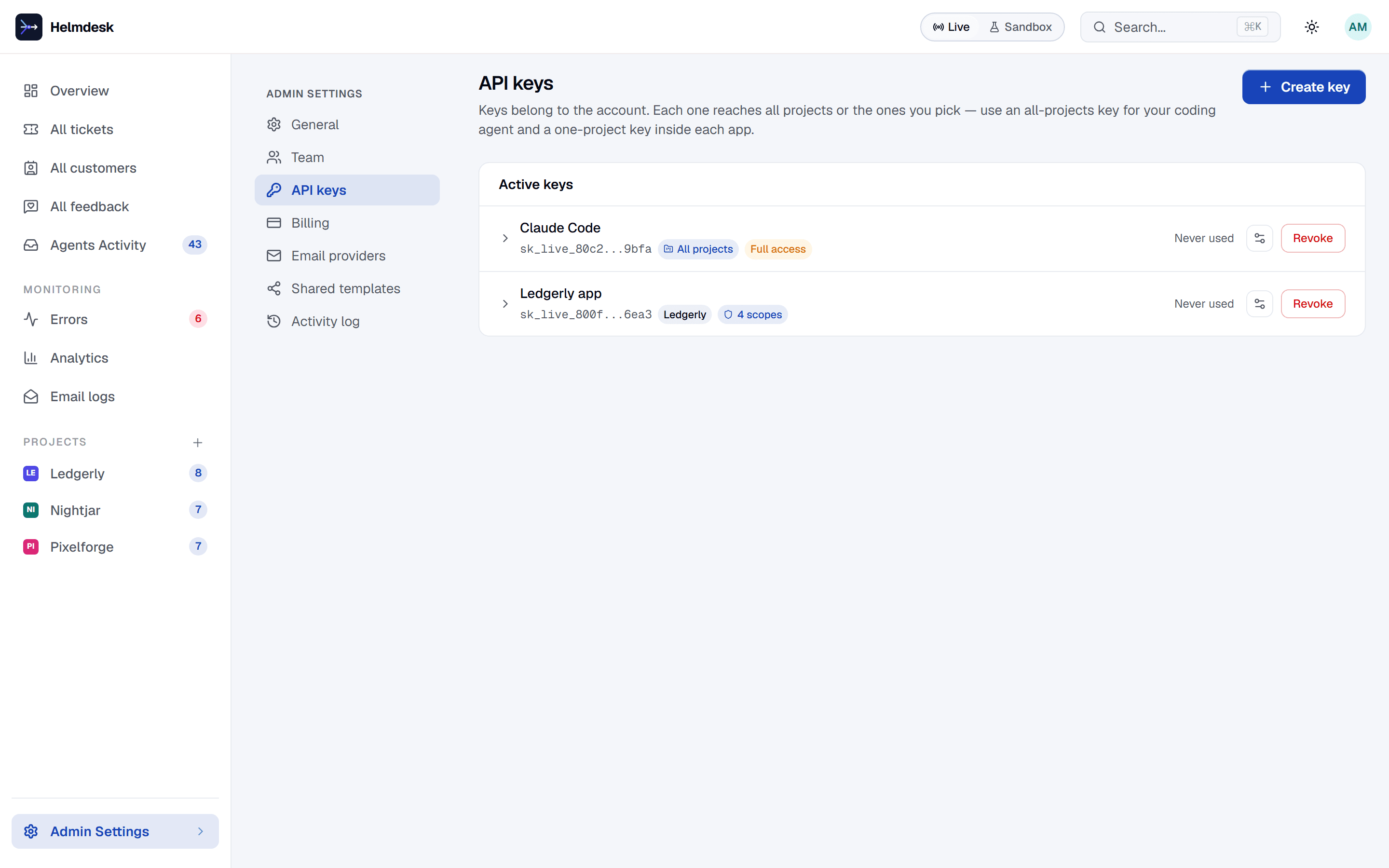 API keys settings: a Claude Code key reaching all projects and a Ledgerly app key with four scopes